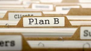 A close up of the word plan b on a file folder