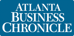 A blue and white logo for the atlanta business chronicle.